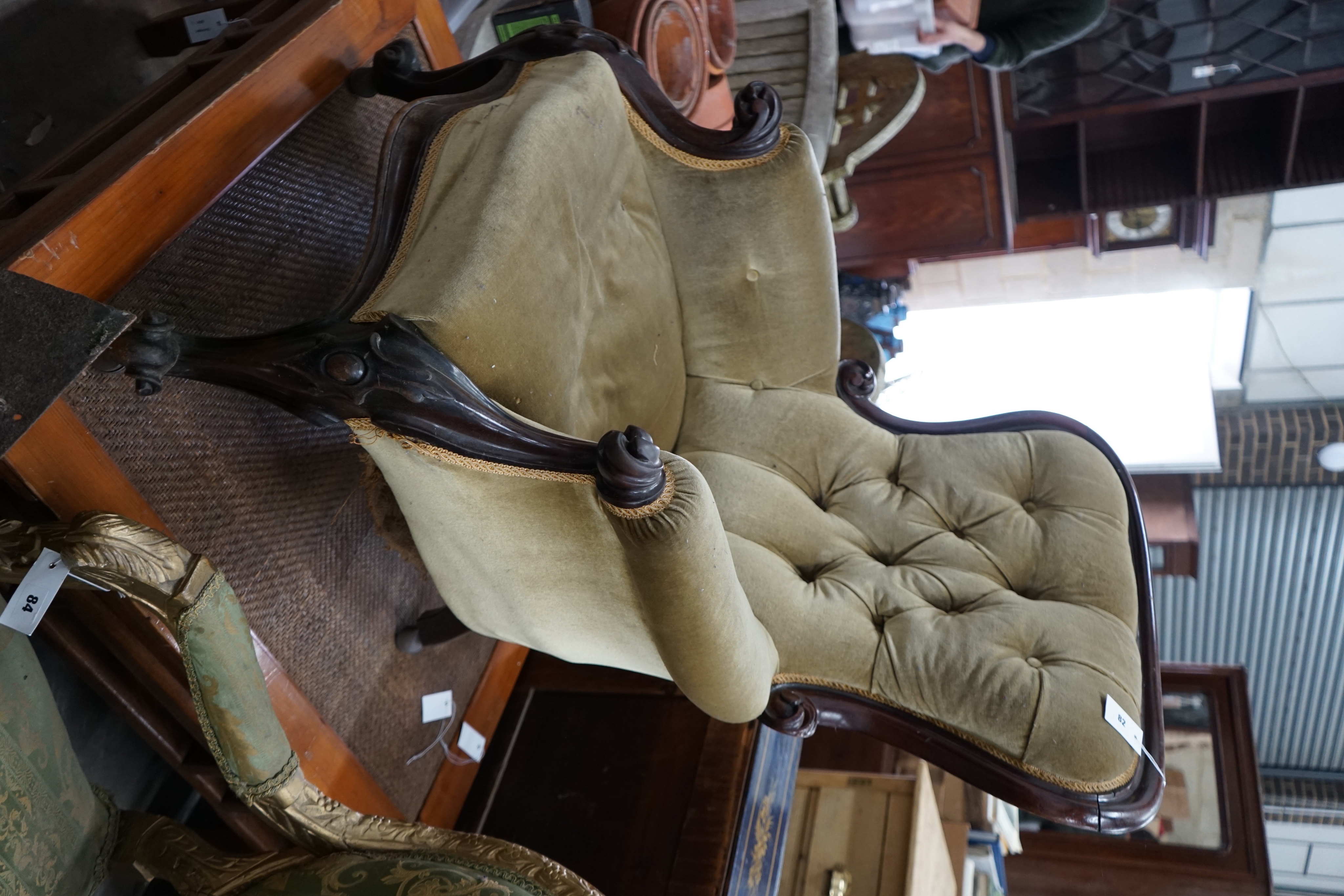 A Victorian mahogany upholstered spoonback armchair, width 70cm depth 70cm height 96cm